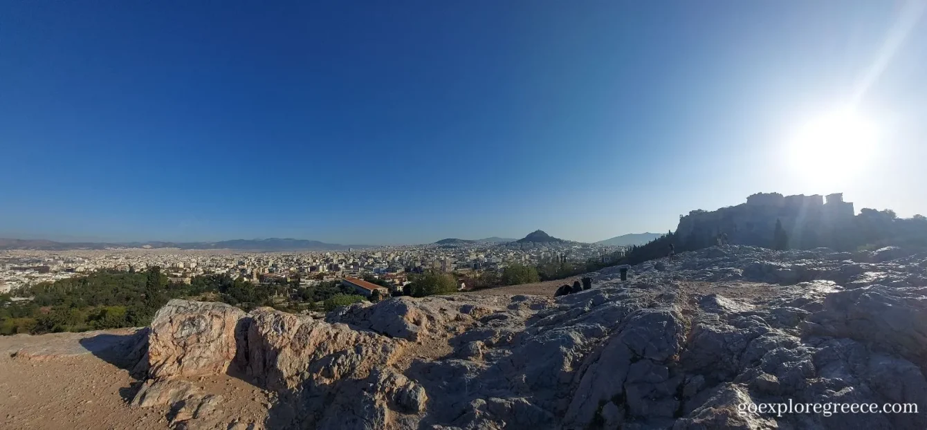 On Areopagus Hill viewing the Acropolis of Athens and Lycabettus hill in the background