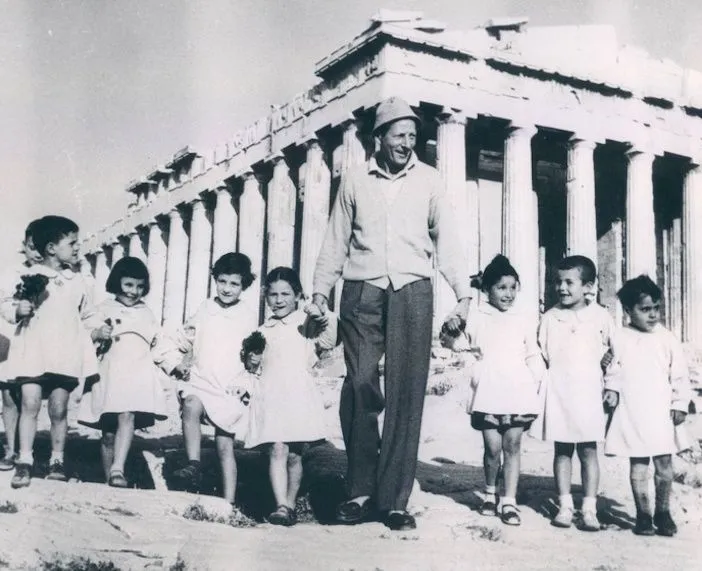 Danny Kaye, the American actor, singer, dancer, comedian, musician, philanthropist, and cook standing in front of the Parthenon on the Acropolis of Athens