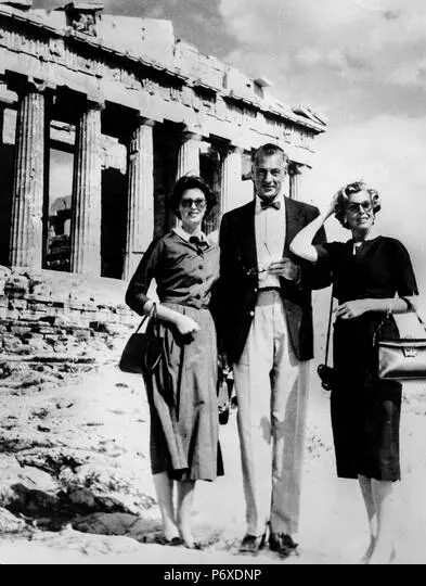 Actor Gary Cooper standing in front of the Parthenon on the Acropolis of Athens in 1956