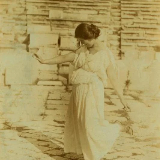 American dancer Isadora Duncan standing in front of the Parthenon on the Acropolis of Athens in 1920