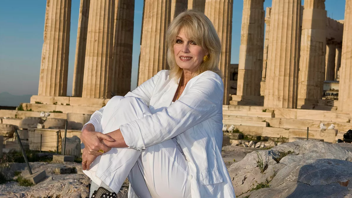 English actress, presenter, former model, author, television producer, and activist Joanna Lumley seated in front of the Parthenon on the Acropolis of Athens in 2011