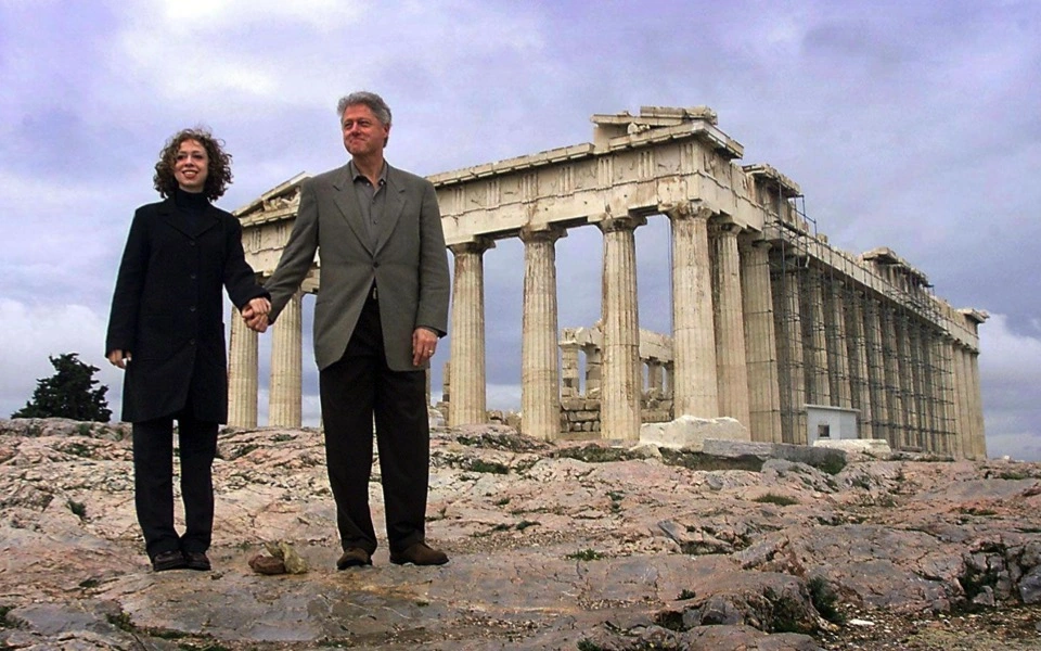 The 42nd President of the United States Bill Clinton with his daughter Chelsea Clinton standing in front of the Parthenon on the Acropolis of Athens in 1999