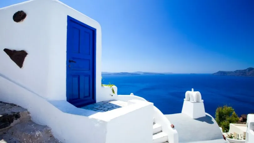 The quintesential blue door and white buildings of Santorini