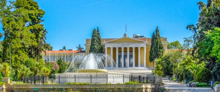 The fountain with the Zappeion Building in the background at the Zappeion Garden Athens