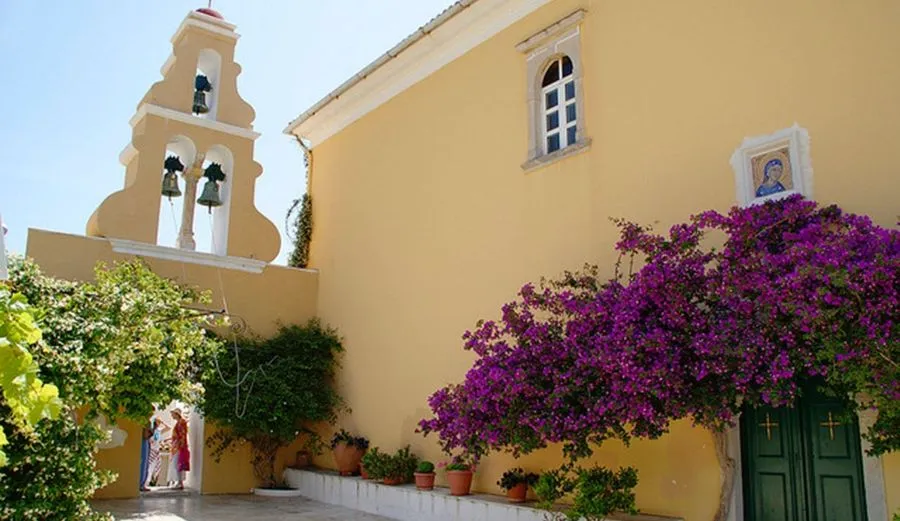 The Holy Monastery of the Virgin Mary Kassopitra showing the three bells from the garden on the Greek island of Corfu in the Ionian Islands Greece