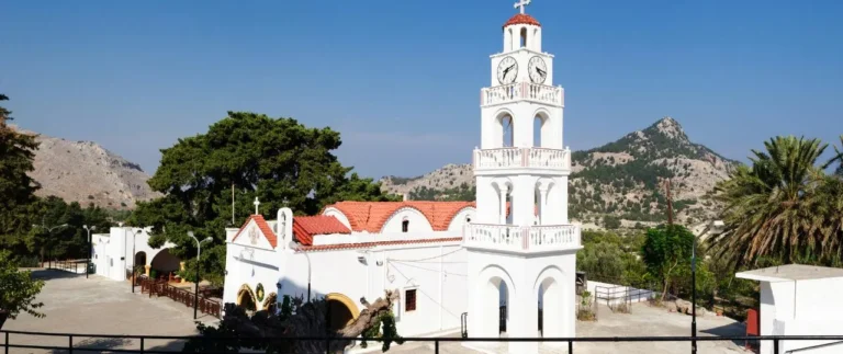 The whie monastery with it's tower and red slate roof of the Tsambika Monastery on Rhodes, Greece