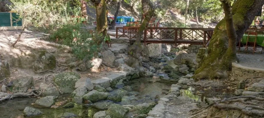 Small wooden bridge over small stream at the Seven Springs in Rhodes, Greece