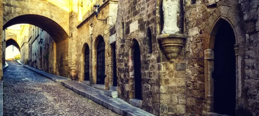 The golden sunlight Street of the Knights of Rhodes. Full of arwayed-doors, and cobbles