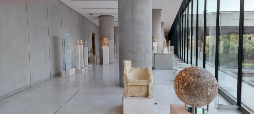 In the Foreground is the Magic Sphere at the Acropolis Museum in Athens