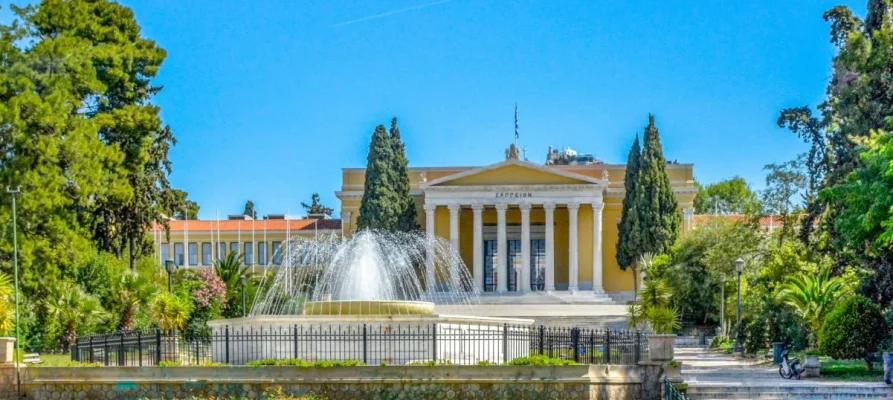 The fountain with the Zappeion Building in the background at the Zappeion Garden Athens