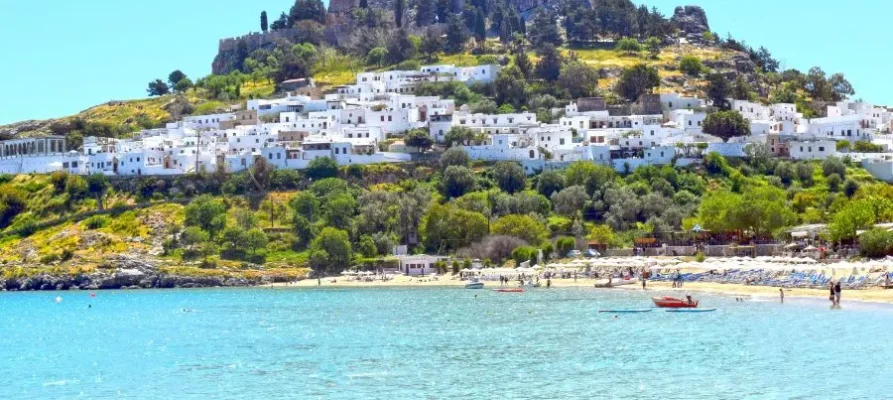 The whitewashed houses of Lindos Village at the base of the Lindos Acropolis on the Greek island of Rhodes in the Dodecanese