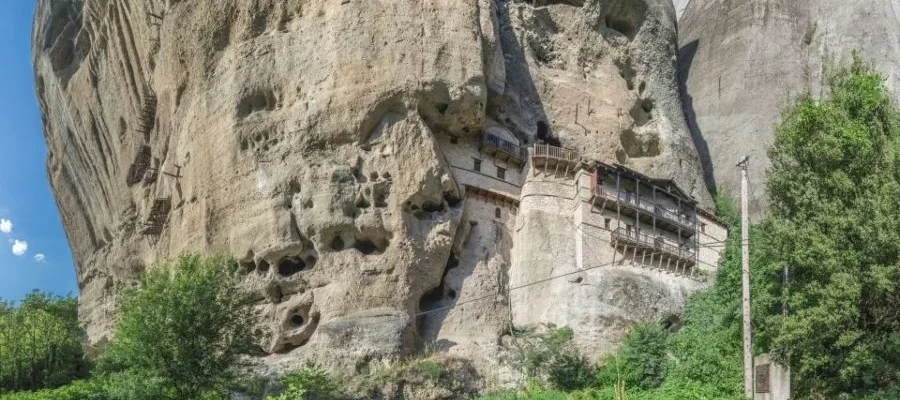 A monastery cut into the rockface. Seen as part of the Meteora Monasteries Train Tour and Hidden Caves