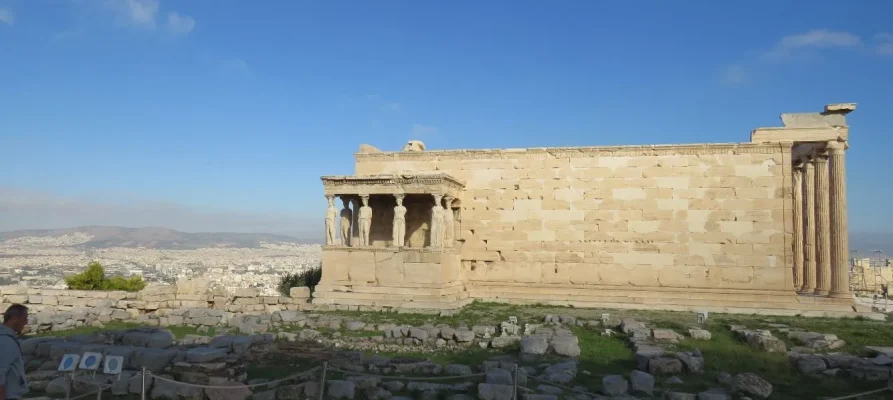 The Erechtheion on the Acropolis of Athens Greece. The female Caryatids can be seen on the left side.