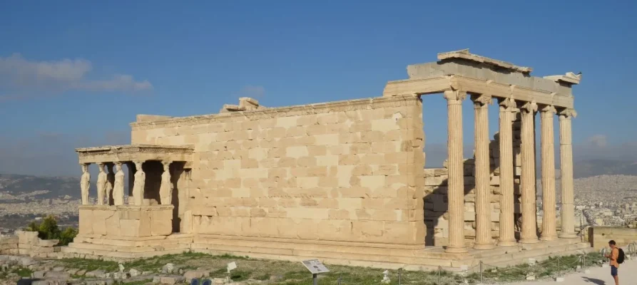 The Erechtheion on the Acropolis of Athens Greece. The female Caryatids can be seen on the left side.