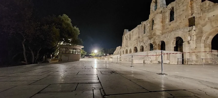 Night-time at the the front of the Odeon of Herodes Atticus on the Acropolis of Athens Greece