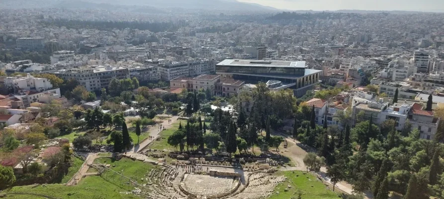 The Theatre of Dionysus on the Acropolis of Athens Greece. In the background is the Acropolis Museum