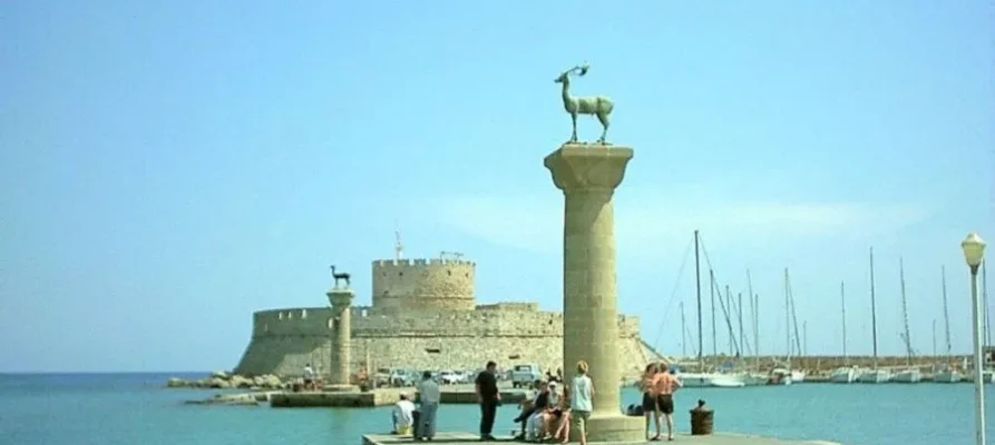 The famous Rhodian Deer statue on stone column at Mandraki Harbour and Port on the Greek island of Rhodes