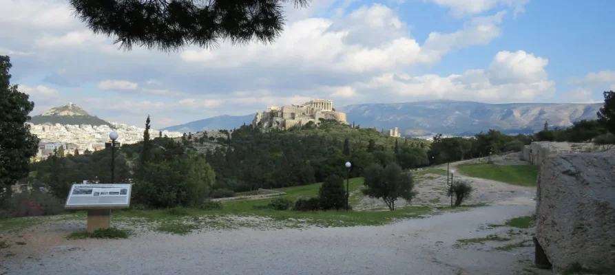 The Acropolis of Athens as viewed from the Pnyx. Lycabettus Hill is in the background on the left