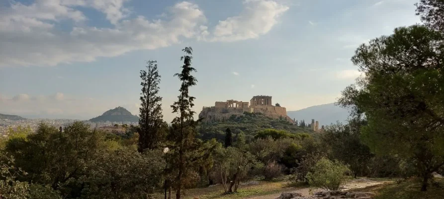 The Acropolis of Athens as viewed from the Pnyx Hill. Lycabettus Hill is in the background on the left