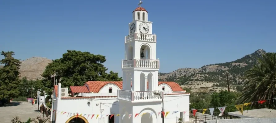 The whie monastery with it's tower and red slate roof of the Tsambika Monastery on Rhodes, Greece