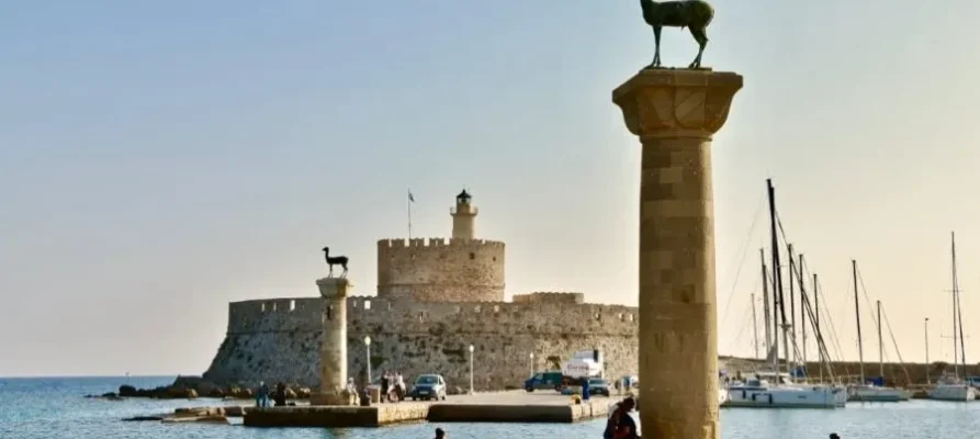 The famous Rhodian Deer statue on stone column at Mandraki Harbour and Port on the Greek island of Rhodes