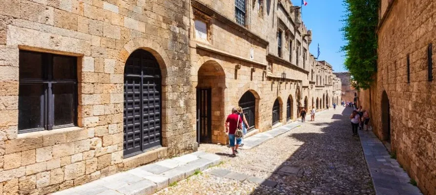 Looking downStreet of the Knights of Rhodes, Greece on a sunny day with the archways left and right, and the cobbled stones