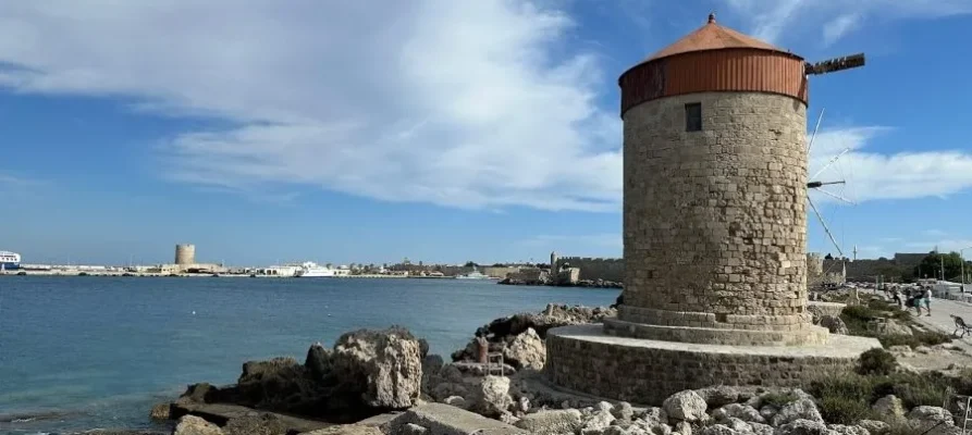 Stone windmill at Mandraki Harbour and Port on the Greek island of Rhodes